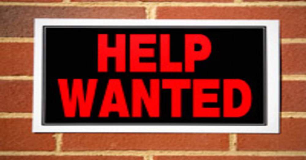 Help wanted sign on brick